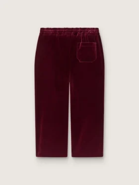 Pantalones para niñas de color burdeos con efecto terciopelo y bolsillo trasero