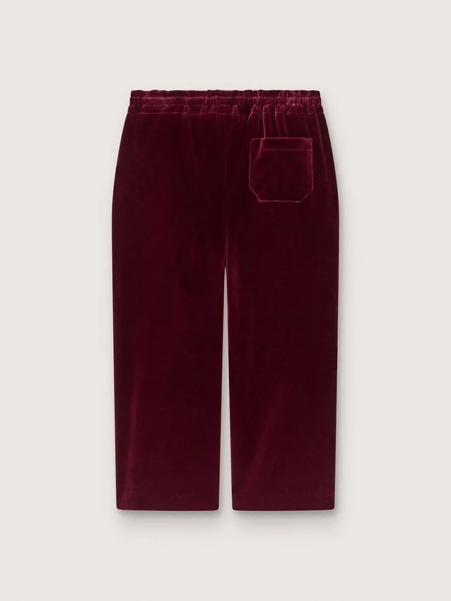 Pantalones para niñas de color burdeos con efecto terciopelo y bolsillo trasero