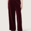 Pantalones para niñas de color burdeos con efecto terciopelo y bolsillo trasero
