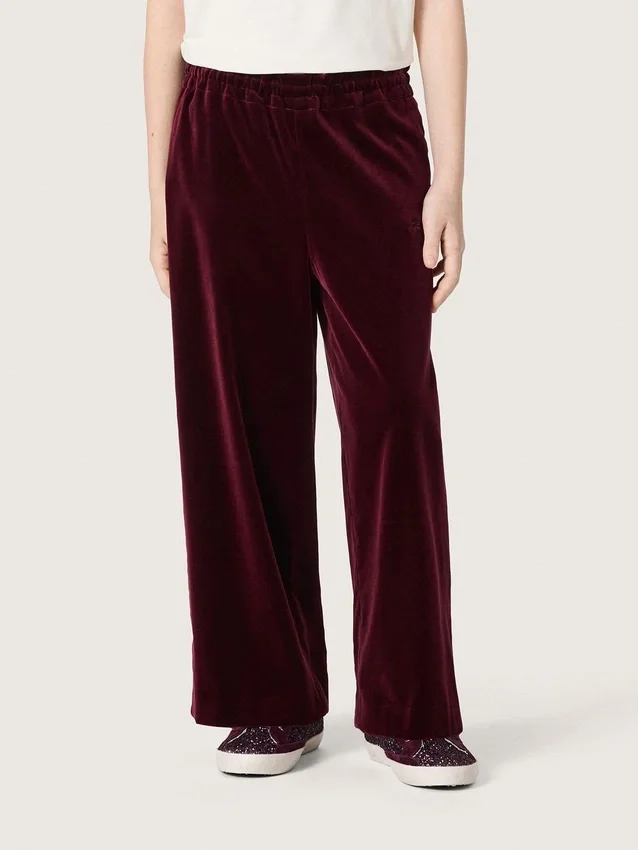 Pantalones para niñas de color burdeos con efecto terciopelo y bolsillo trasero