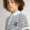 Polo blanco de algodón para niños con rayas azul marino y bordado
