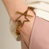 Pulsera de cadena decreciente en oro antiguo con cierre en forma de estrella