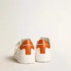 Purestar para hombre con estrella de cuero blanco y lengüeta del talón naranja