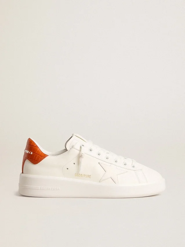 Purestar para mujer con estrella de cuero blanco y lengüeta naranja en el talón