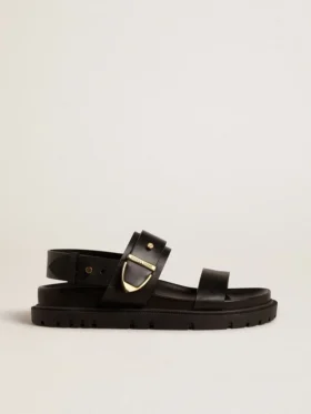 Sandalia Lucy para mujer en cuero negro brillante con hebilla de metal dorado
