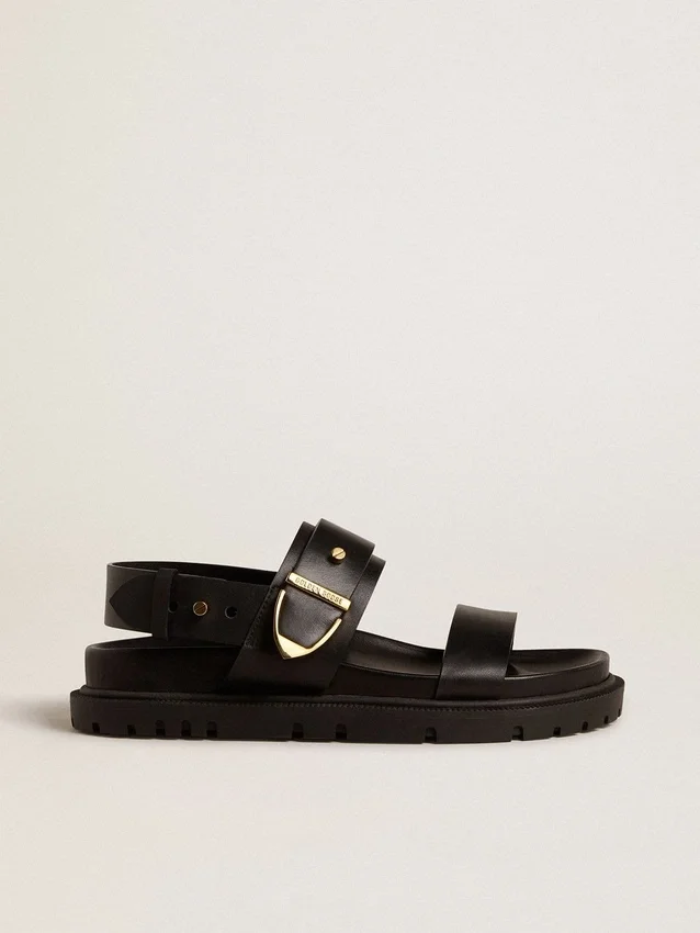 Sandalia Lucy para mujer en cuero negro brillante con hebilla de metal dorado