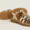 Sandalias Maxime Young en cuero dorado
