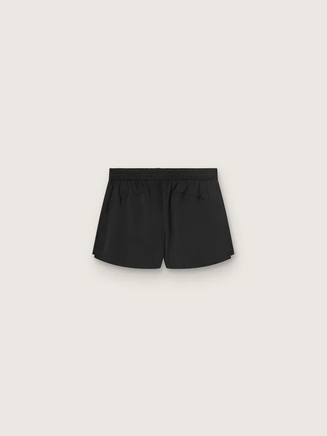 Shorts deportivos negros de doble capa para mujer