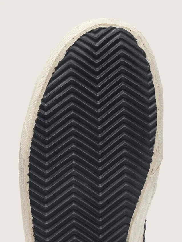 Slide para mujer en negro y purpurina plateada con estrella de cuero y detalles metálicos