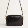 Star Bag en cuero negro brillante con estrella tono sobre tono