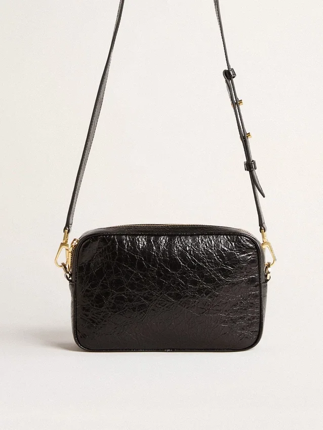 Star Bag en cuero negro brillante con estrella tono sobre tono