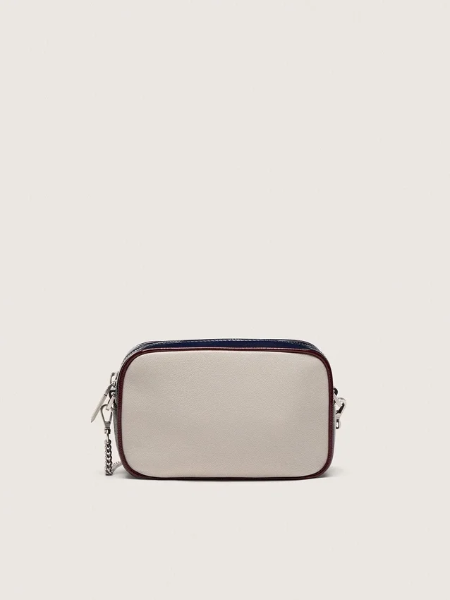 Star Bag Mini en cuero blanco mantequilla con estrella negra y detalles en burdeos y azul oscuro