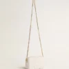 Star Bag Mini en cuero blanco mantequilla con estrella tono sobre tono