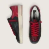 Stardan para hombre en cuero negro con estrella roja e inserciones de malla negra y cuero rojo