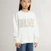 Sudadera blanca para niñas con letras doradas multicolores en el frente