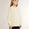 Sudadera color crema para niñas con letras en parches