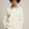 Sudadera con cremallera de la Star Collection en blanco papiro con cuello de cristales