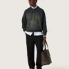 Sudadera unisex con capucha de algodón negro con efecto decolorado