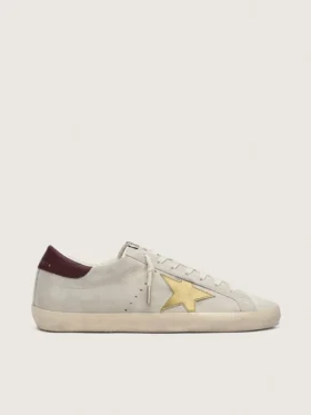 Super-Star CNY para mujer en gamuza color marfil con estrella de cuero metalizado y lengüeta de cuero en el talón
