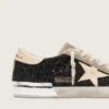 Super-Star en negro con purpurina, estrella color crema e inserciones de gamuza