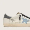 Super-Star en piel napa con estrella de gamuza azul claro y lengüeta del talón de piel gris