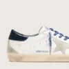 Super-Star LTD para hombre en cuero blanco con estrella de gamuza y lengüeta del talón de cuero azul