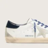 Super-Star LTD para mujer en cuero blanco con estrella de gamuza y lengüeta de talón de cuero azul