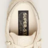 Super-Star LTD para mujer en gamuza color perla con estrella dorada y bordado de cuentas