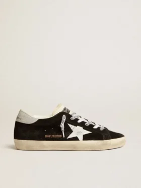 Super-Star LTD para mujer en gamuza negra con estrella impresa en blanco y lengüeta del talón con purpurina plateada
