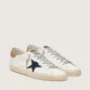 Super-Star para hombre en cuero blanco con estrella de lona azul medianoche y lengüeta del talón de cuero color tabaco