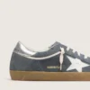 Super-Star para hombre en gamuza gris con estrella de cuero blanco y lengüeta de talón de cuero plateado