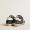 Super-Star para hombre en gamuza verde con estrella de cuero metalizado plateado y lengüeta de cuero en el talón