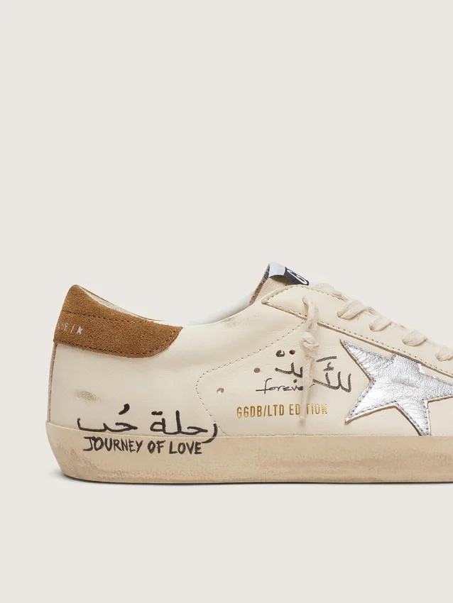 Super-Star para hombre en napa con estrella plateada metalizada y letras por toda la superficie