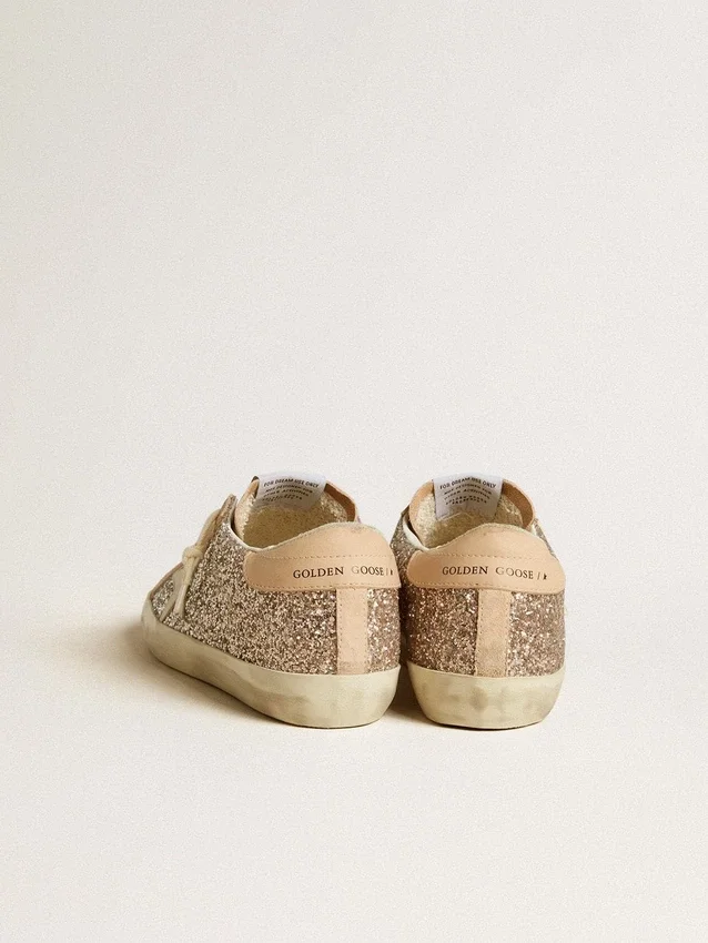 Super-Star para mujer en brillo plateado con estrella de cuero y lengüeta en el talón