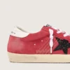 Super-Star para mujer en gamuza roja con estrella brillante y lengüeta blanca en el talón