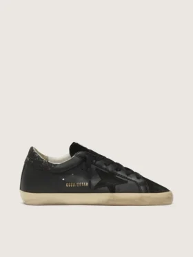 Super-Star para mujer en napa negra con estrella negra y lengüeta del talón con purpurina