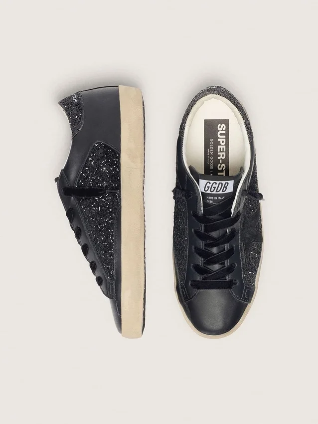 Super-Star para mujer en negro con purpurina, estrella de gamuza negra e inserciones de cuero