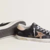 Super-Star para mujer en piel napa negra con estrella de piel de potro con estampado de cebra y lengüeta del talón de piel beige