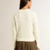 Suéter de mujer de cuello redondo en lana merino blanca con cristales por toda la prenda