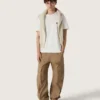 Suéter unisex de cuello redondo en algodón beige con parche en el frente y logotipo en la espalda