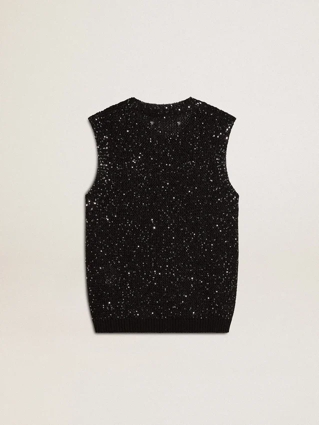 Top de malla negra con lentejuelas y detalles en contraste