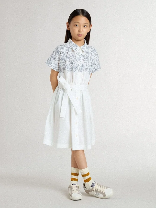 Vestido de camisa para niñas en lona de algodón blanca con estampado náutico azul y ribete blanco