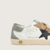 Zapatillas Junior Old School con estrella de cuero negro e inserciones de gamuza beige y verde