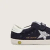 Zapatillas Junior Old School en gamuza azul con estrella plateada con purpurina y lengüeta de cuero blanco en el talón