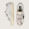 Zapatillas Old School para mujer en cuero blanco con estrella de cuero negro e inserciones con estampado de serpiente