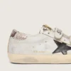 Zapatillas Old School para mujer en cuero blanco con estrella de cuero negro e inserciones con estampado de serpiente
