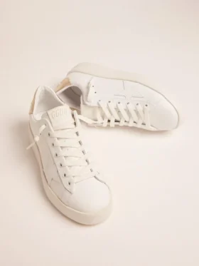 Zapatillas Purestar para mujer con lengüeta en el talón de color dorado