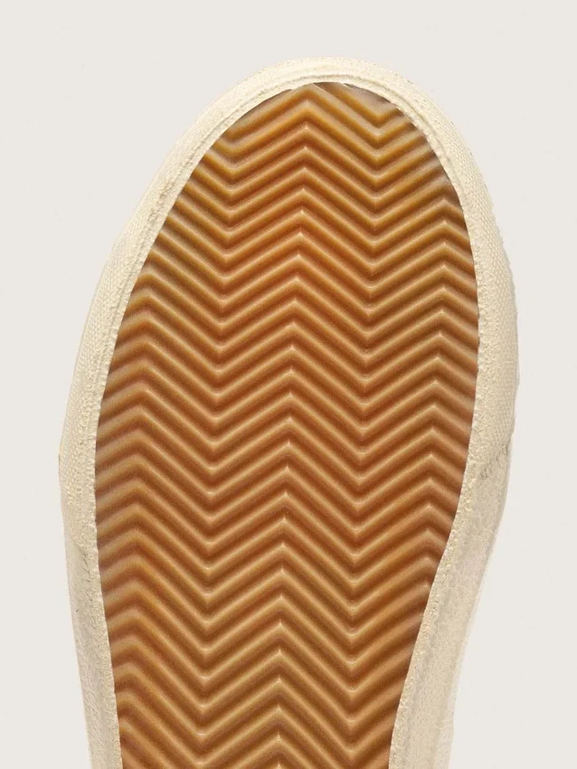 Zapatillas Slide en beige con estrella y detalle brillante de cuero rosa metalizado
