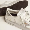 Zapatillas Stardan con estrella de cuero metalizado plateado y lengüeta en el talón