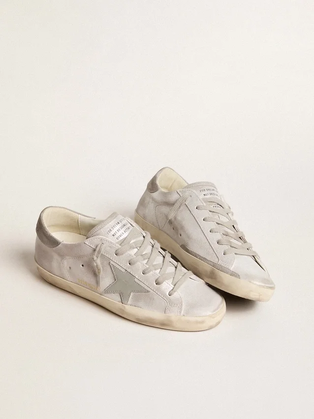 Zapatillas Super-Star en cuero gris-blanco con efecto brillante y estrella de cuero